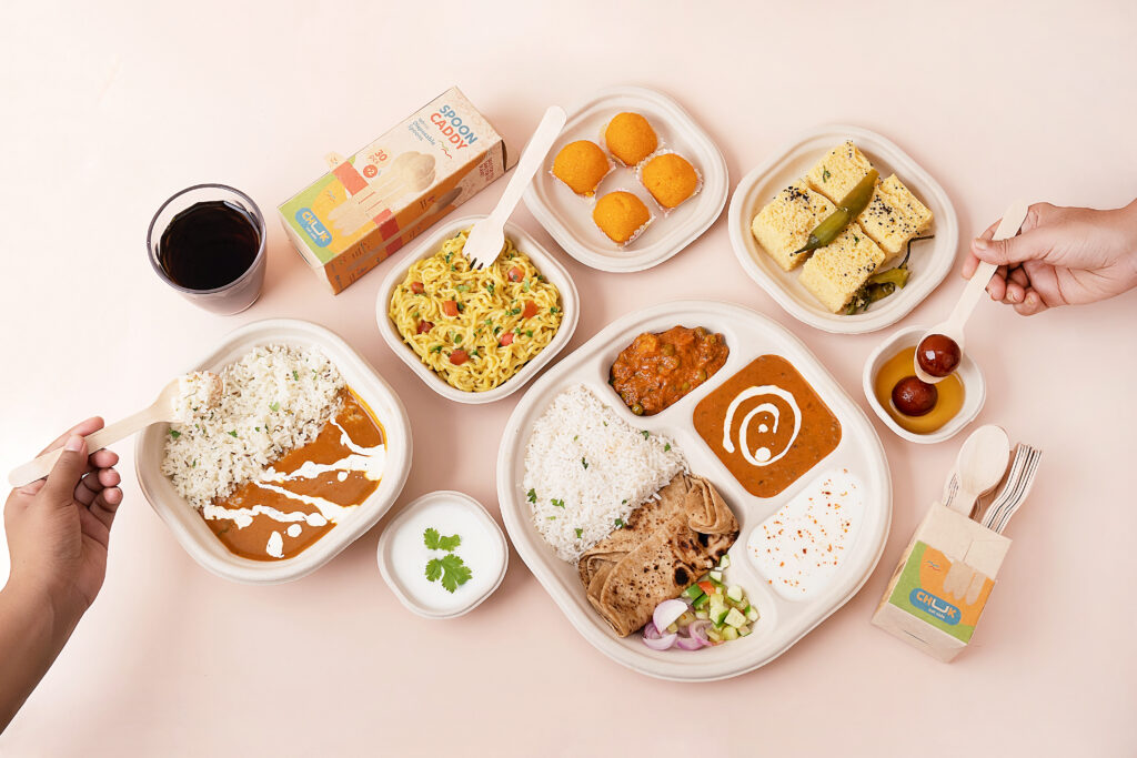 Disposable bagasse plates & Bowls holding North Indian style food