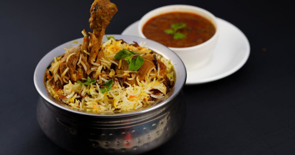 Indian biryani served with curry - the kind of hero photo a Zomato listing needs