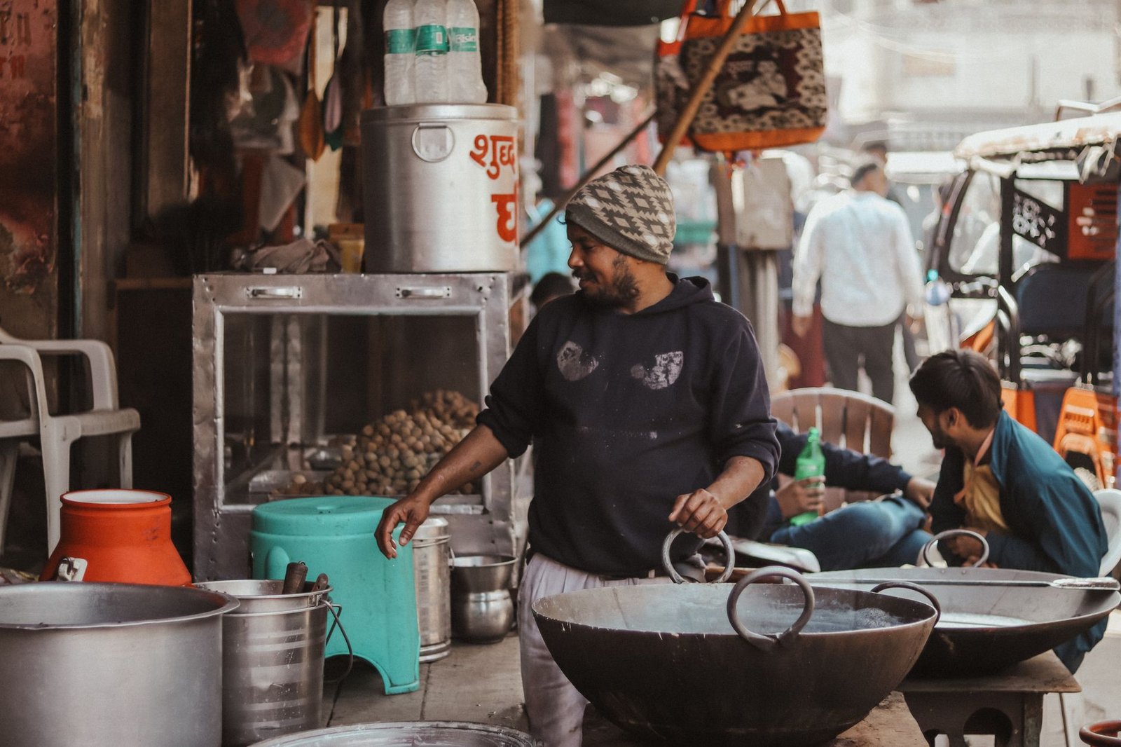 Indian cook preparing traditional food in a busy kitchen for a delivery-only brand