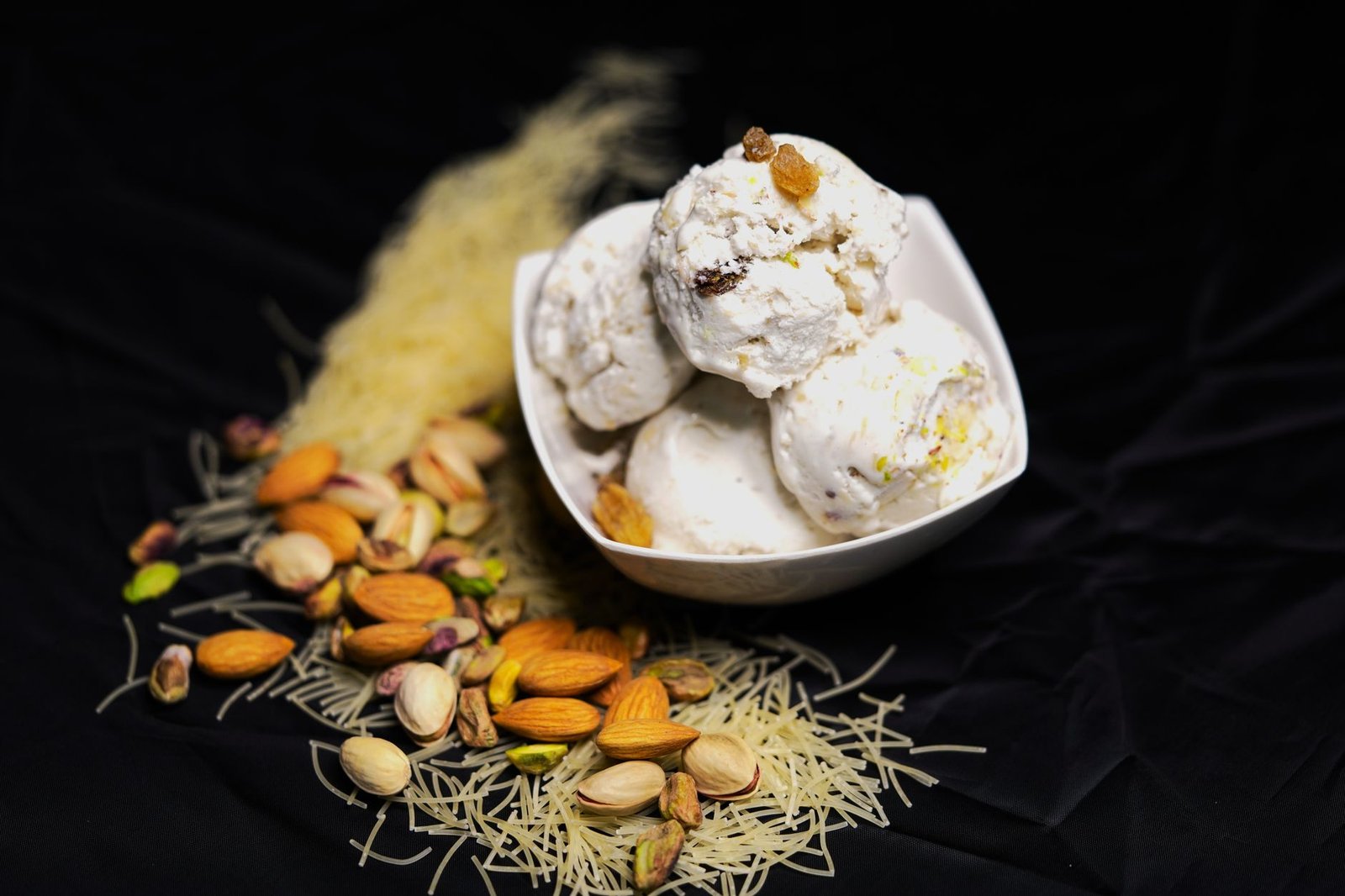 Creamy Indian kulfi with vermicelli and nuts, a festive Eid al-Adha dessert