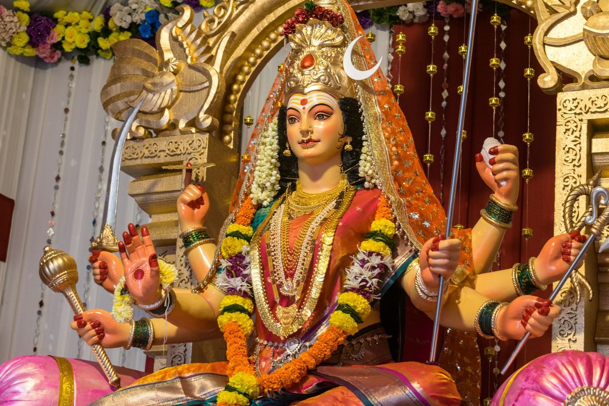 Ornately adorned Goddess Durga idol with marigold garlands worshipped during Navratri